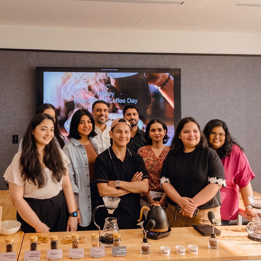 A Moonwalk coffee tasting event with a team gathered around a pour-over bar